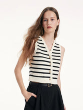 a woman in striped gilet